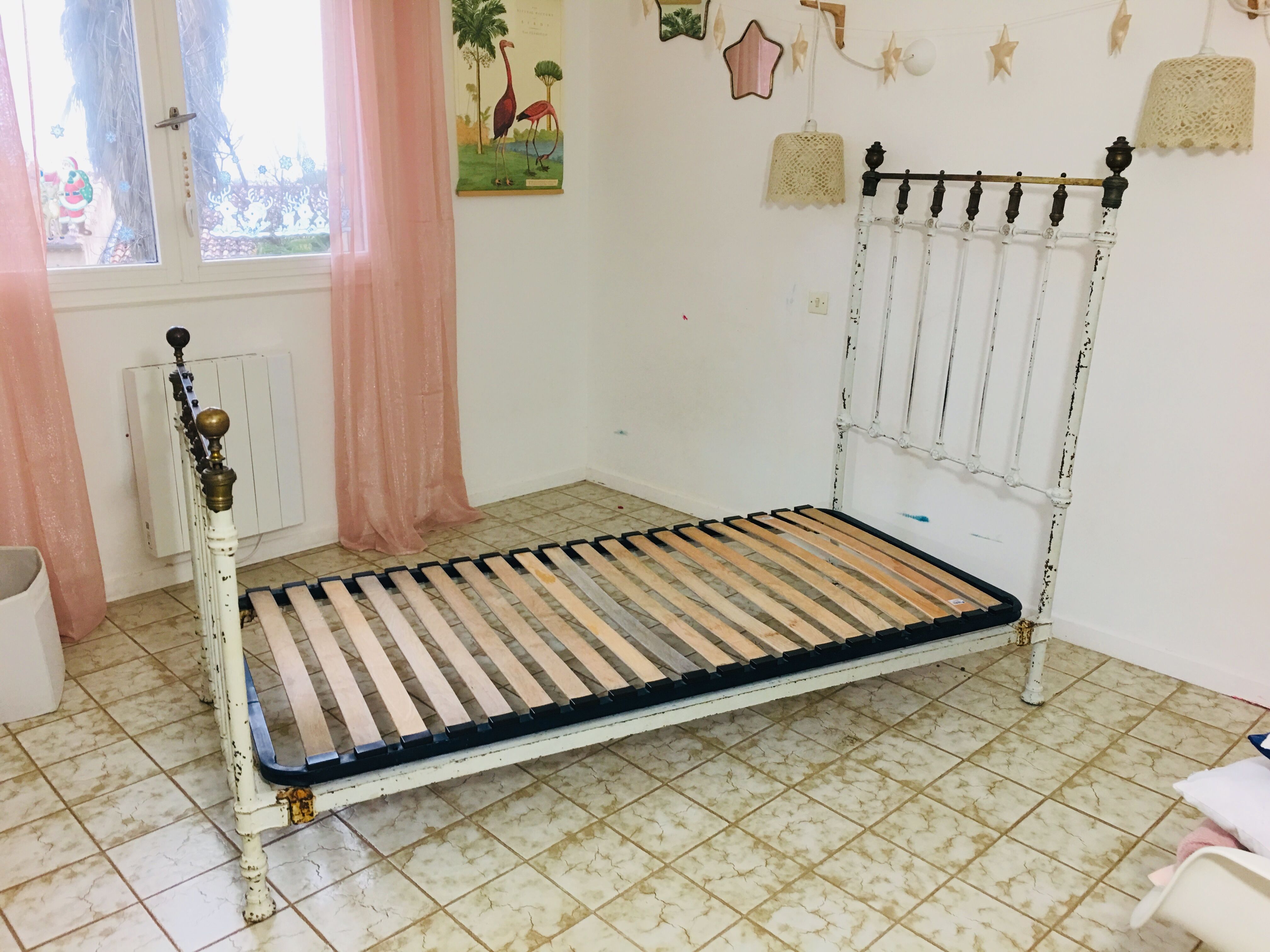 Old white metal and brass bed