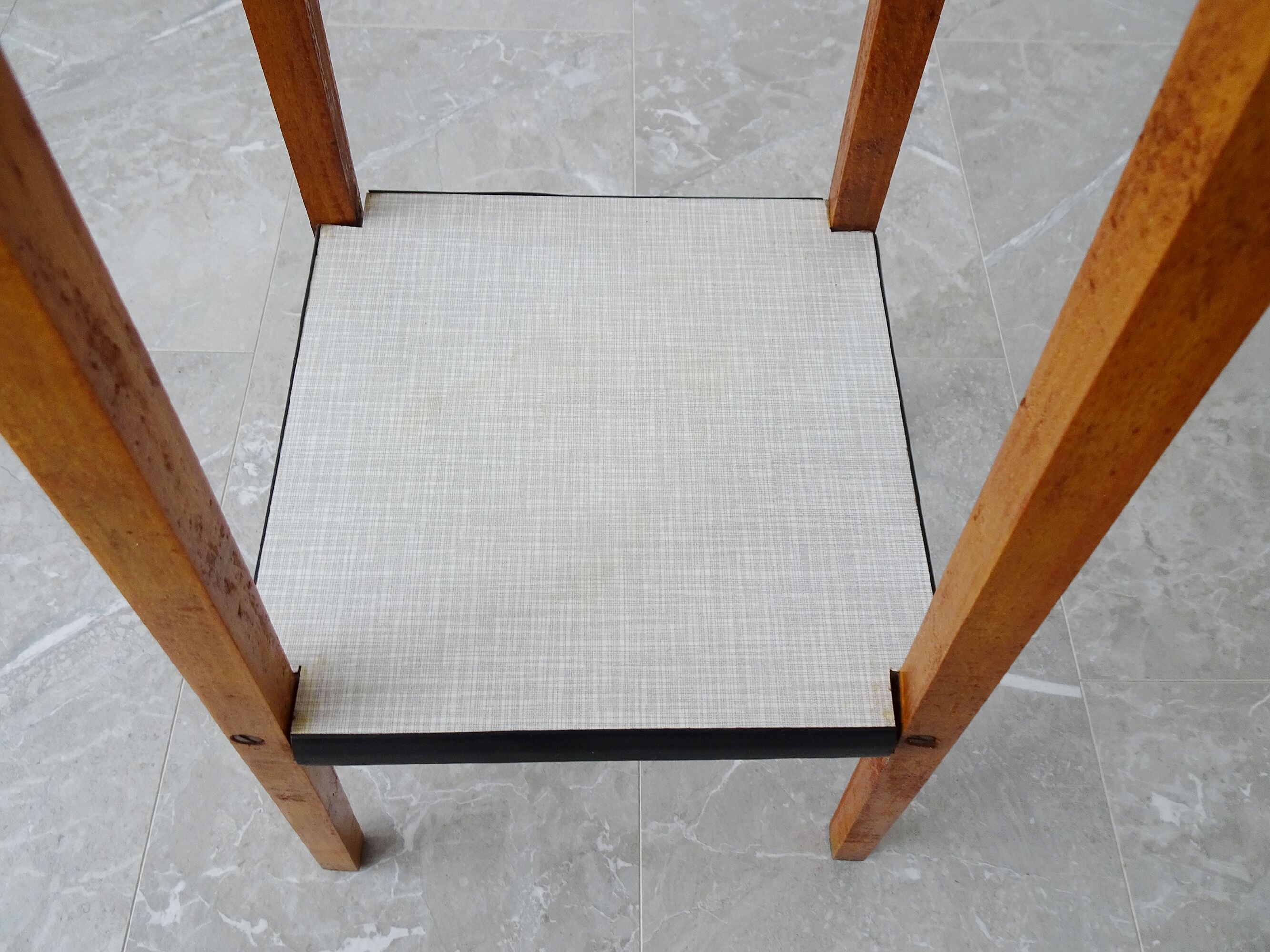 Plant stand made of wood and formica with two shelves, flower column