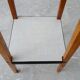Plant stand made of wood and formica with two shelves, flower column