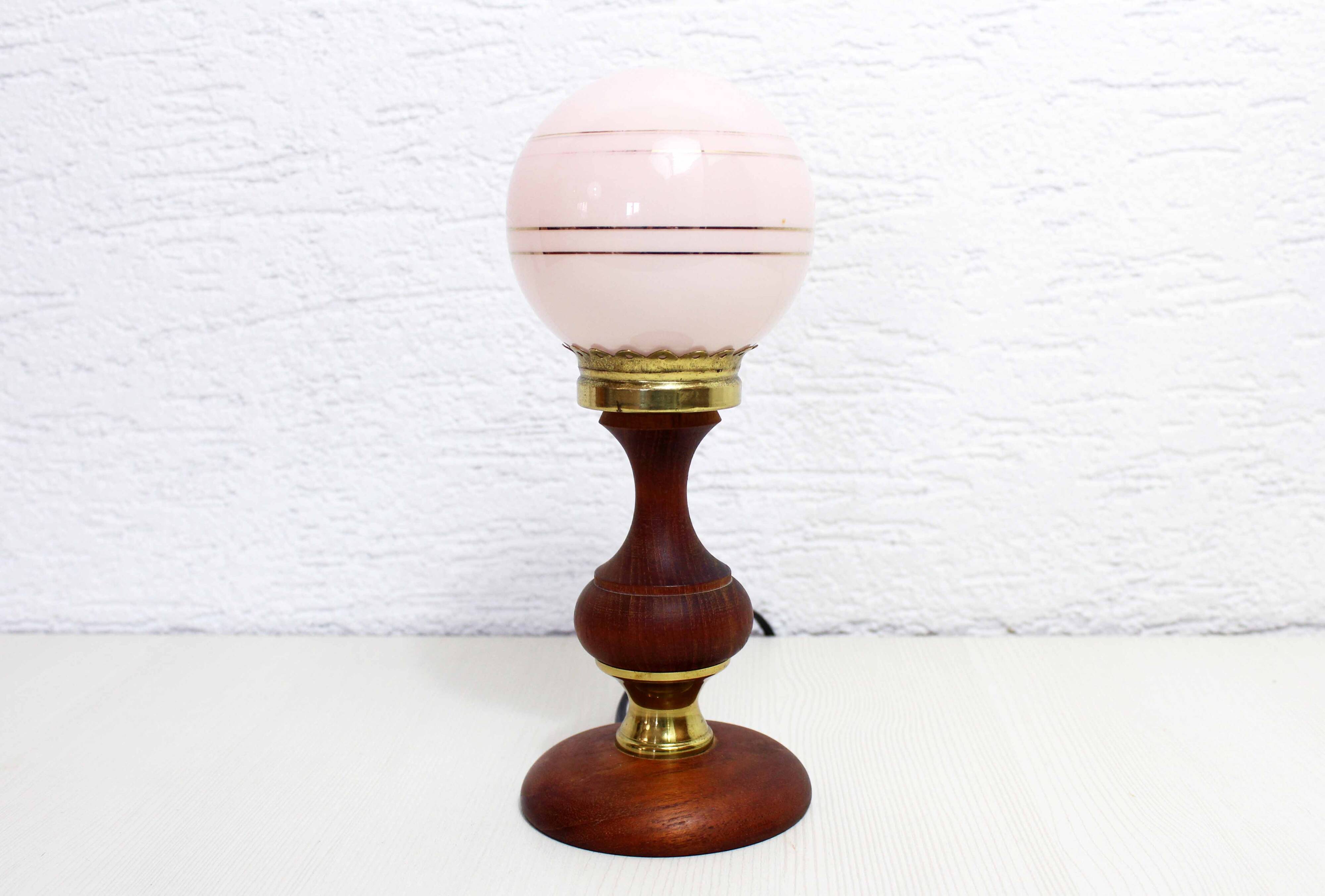 Turned wood and pink glass lamp