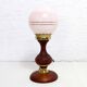Turned wood and pink glass lamp