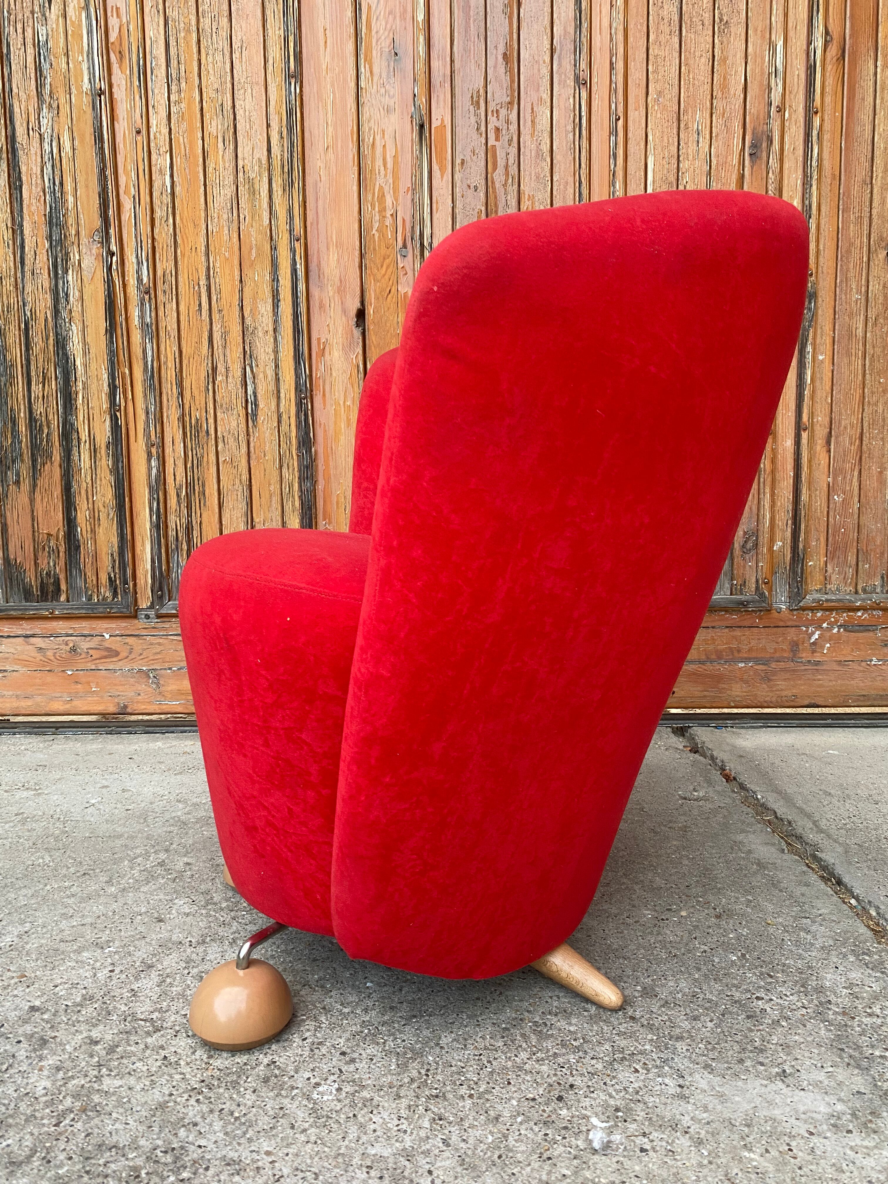 Mid-century red armchair with special legs