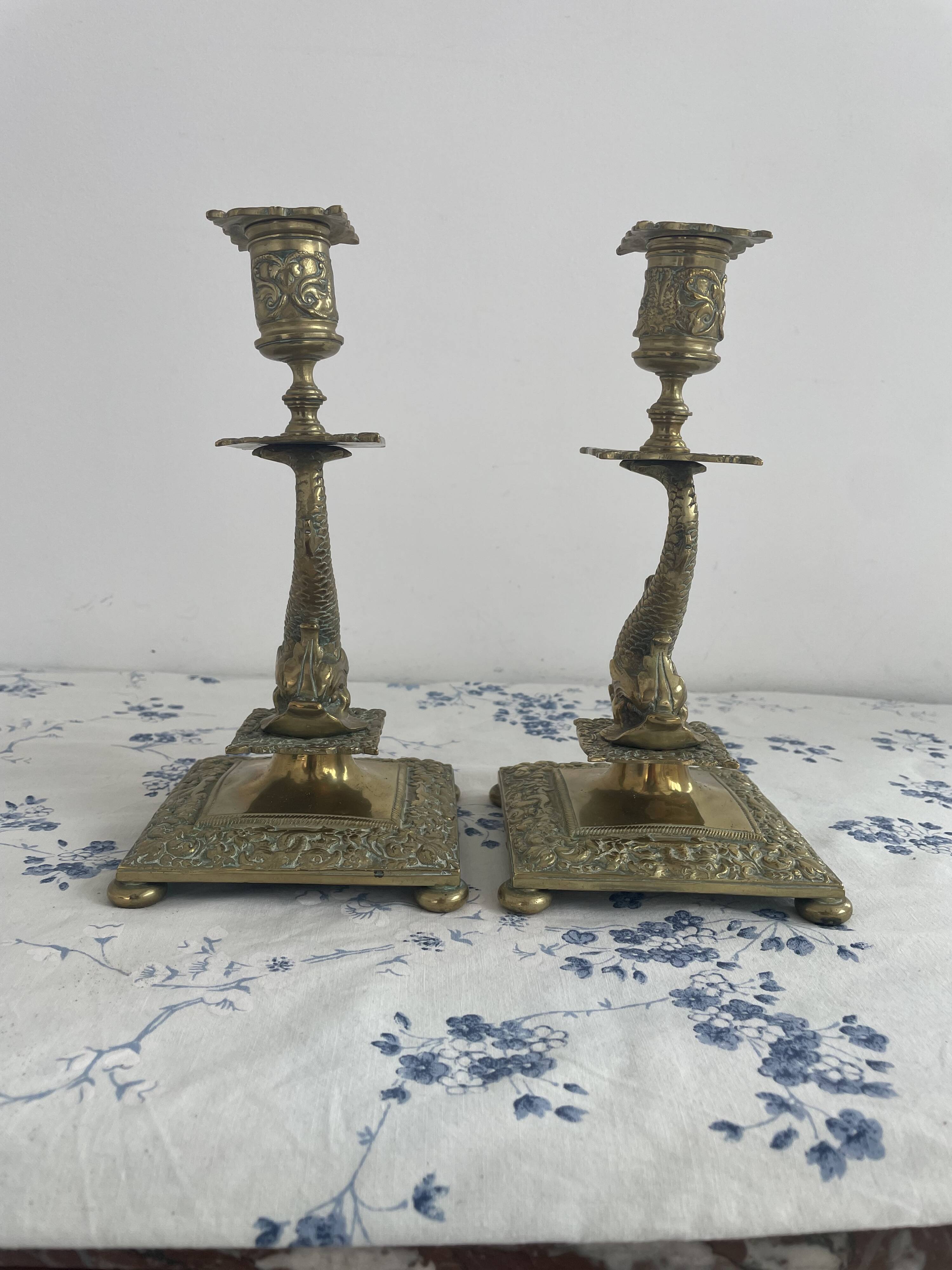 Pair of brass dolphin candlesticks, late 19th century, Napoleonic period