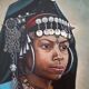 Portrait of a young Moroccan woman in traditional attire and adornments.