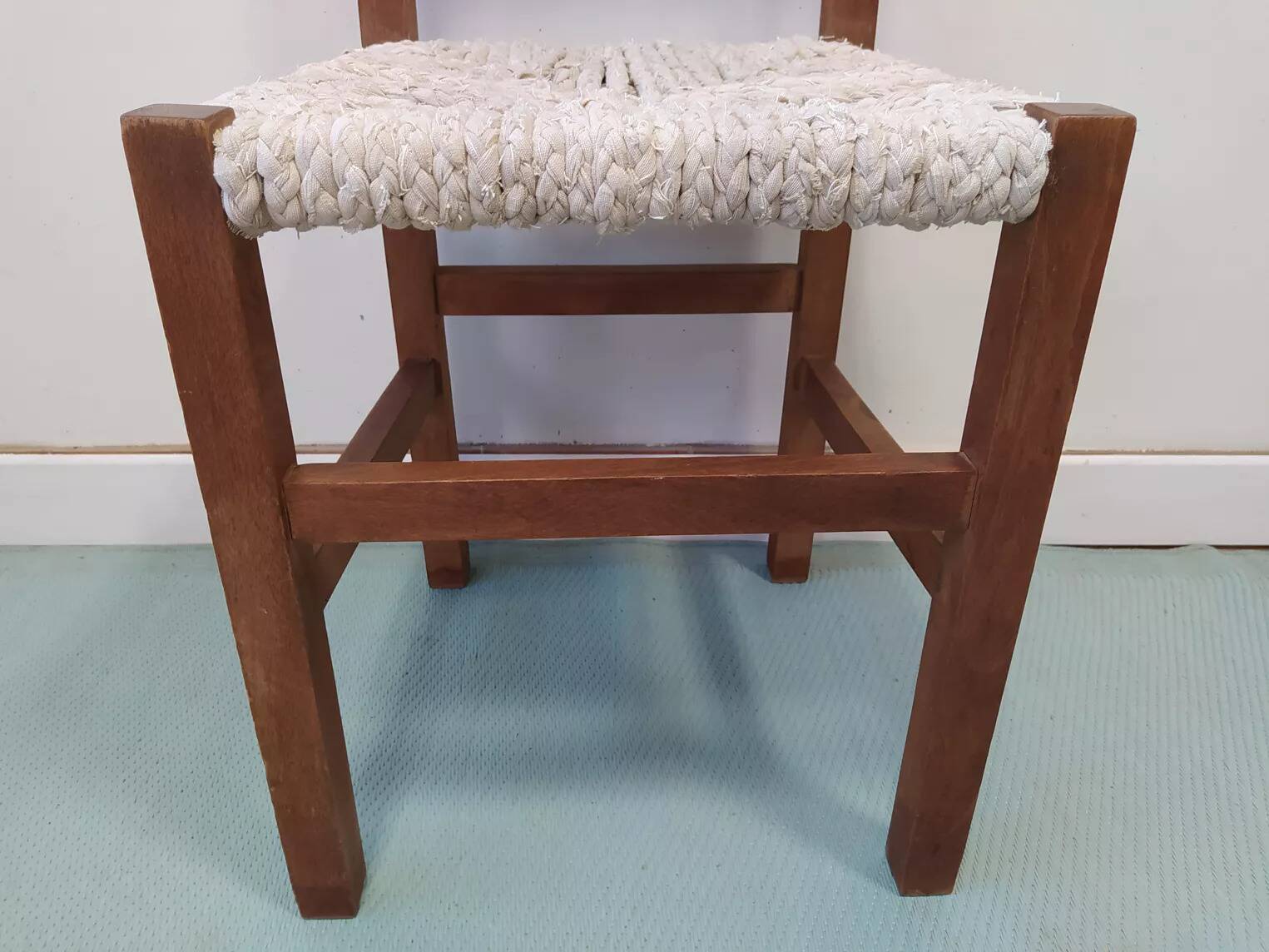 Wooden chair with woven rope seat