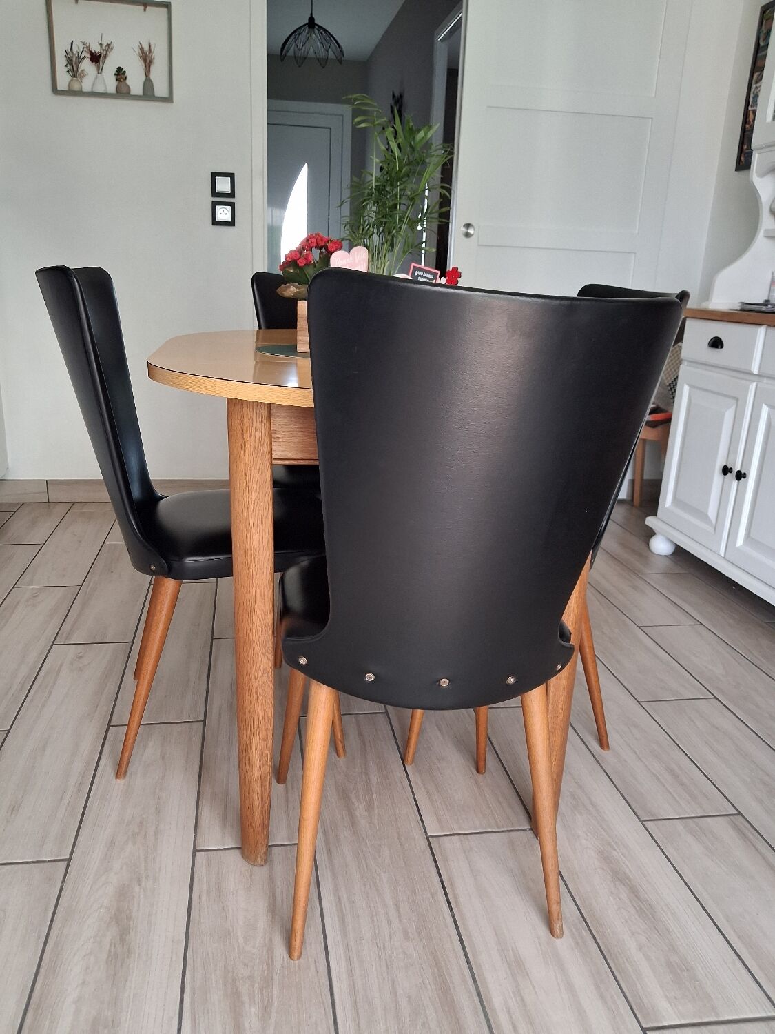 4 black Baumann style chairs