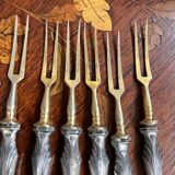 Set of knives and forks for fruits.