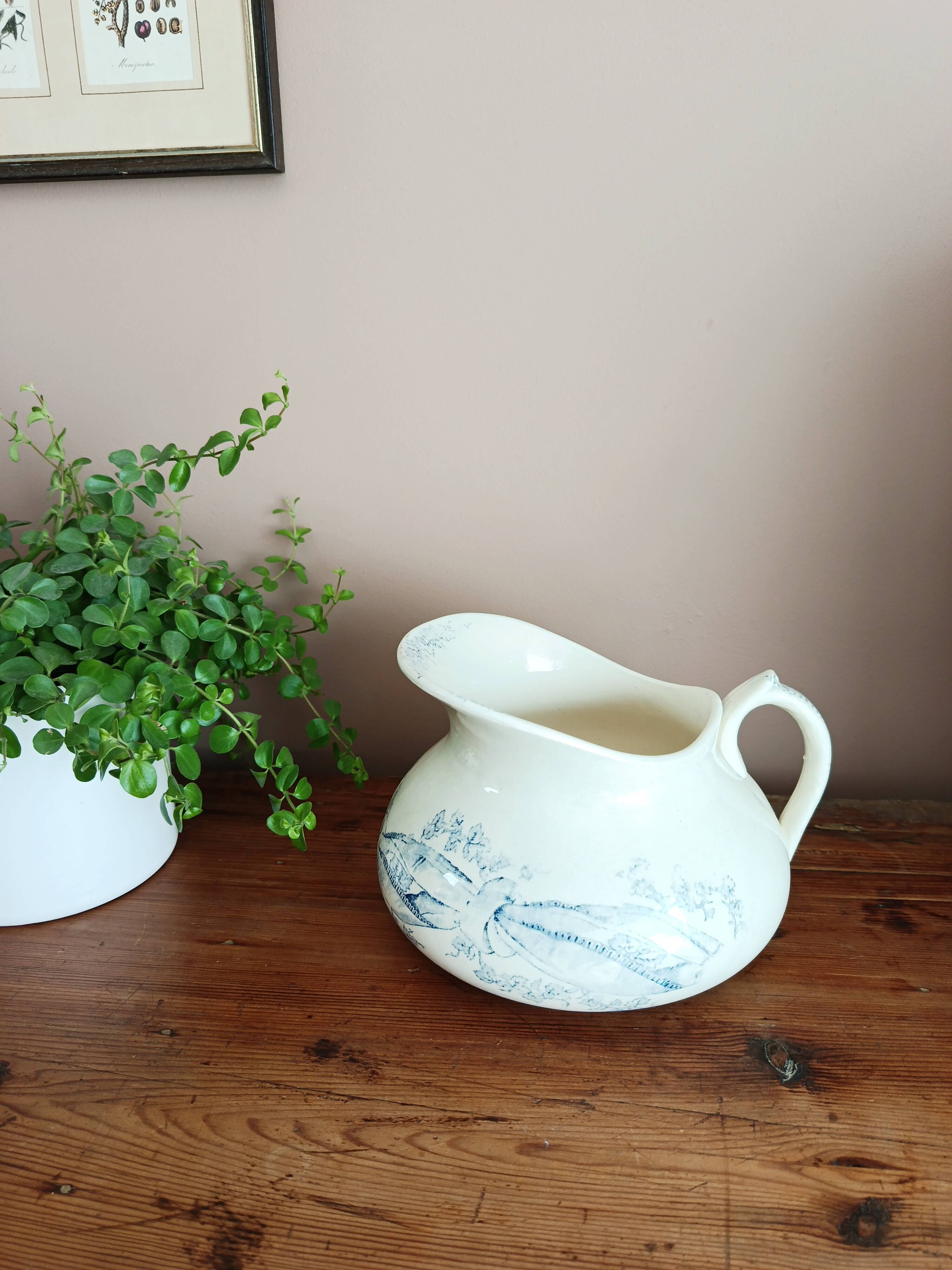 Old bulbous jug in ironstone earthenware