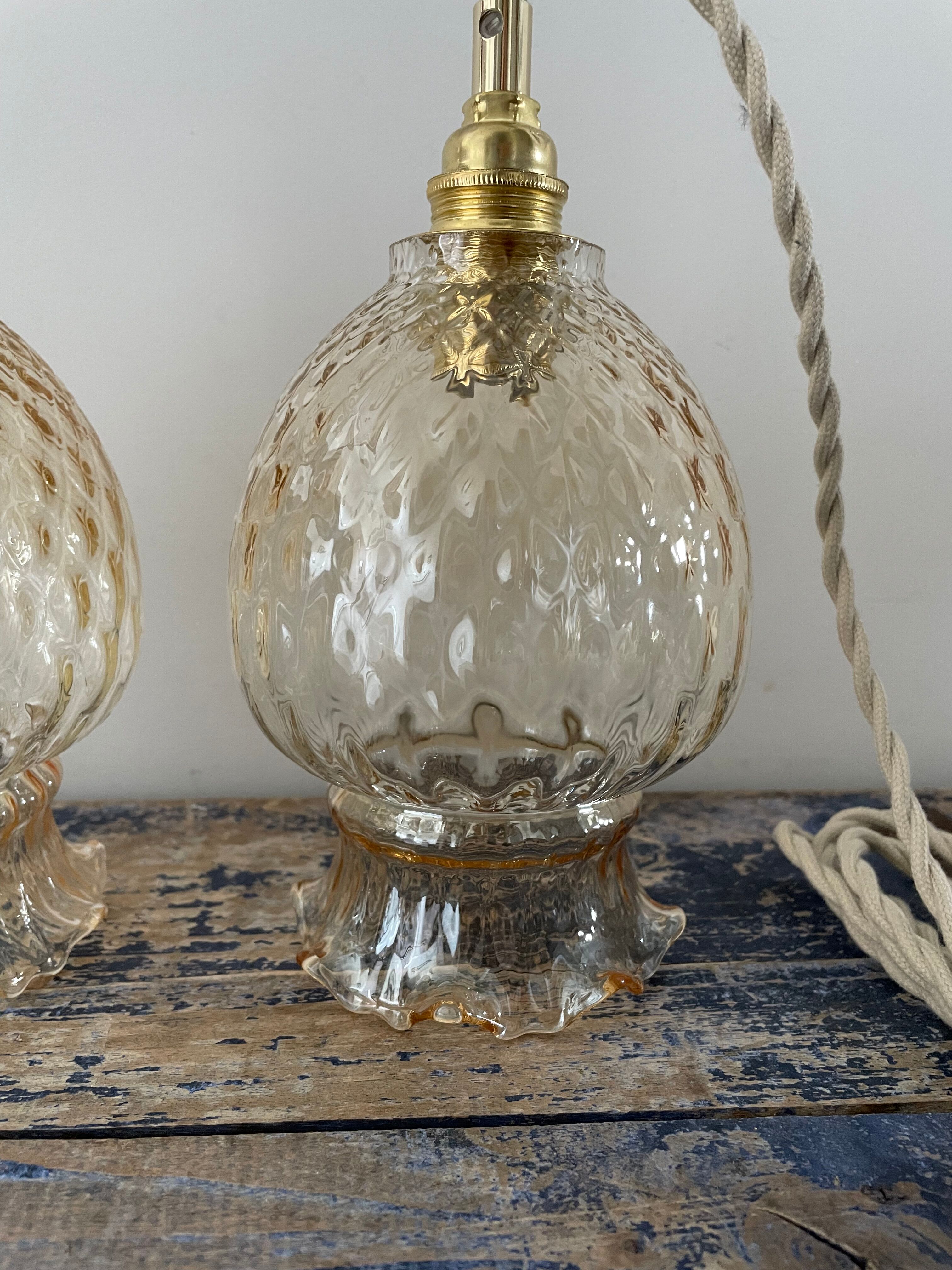 Set of two vintage golden glass handhelds