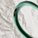 Vintage pitcher in green enameled sheet metal