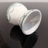 Old porcelain diabolo egg cup decorated with green frieze and garlands