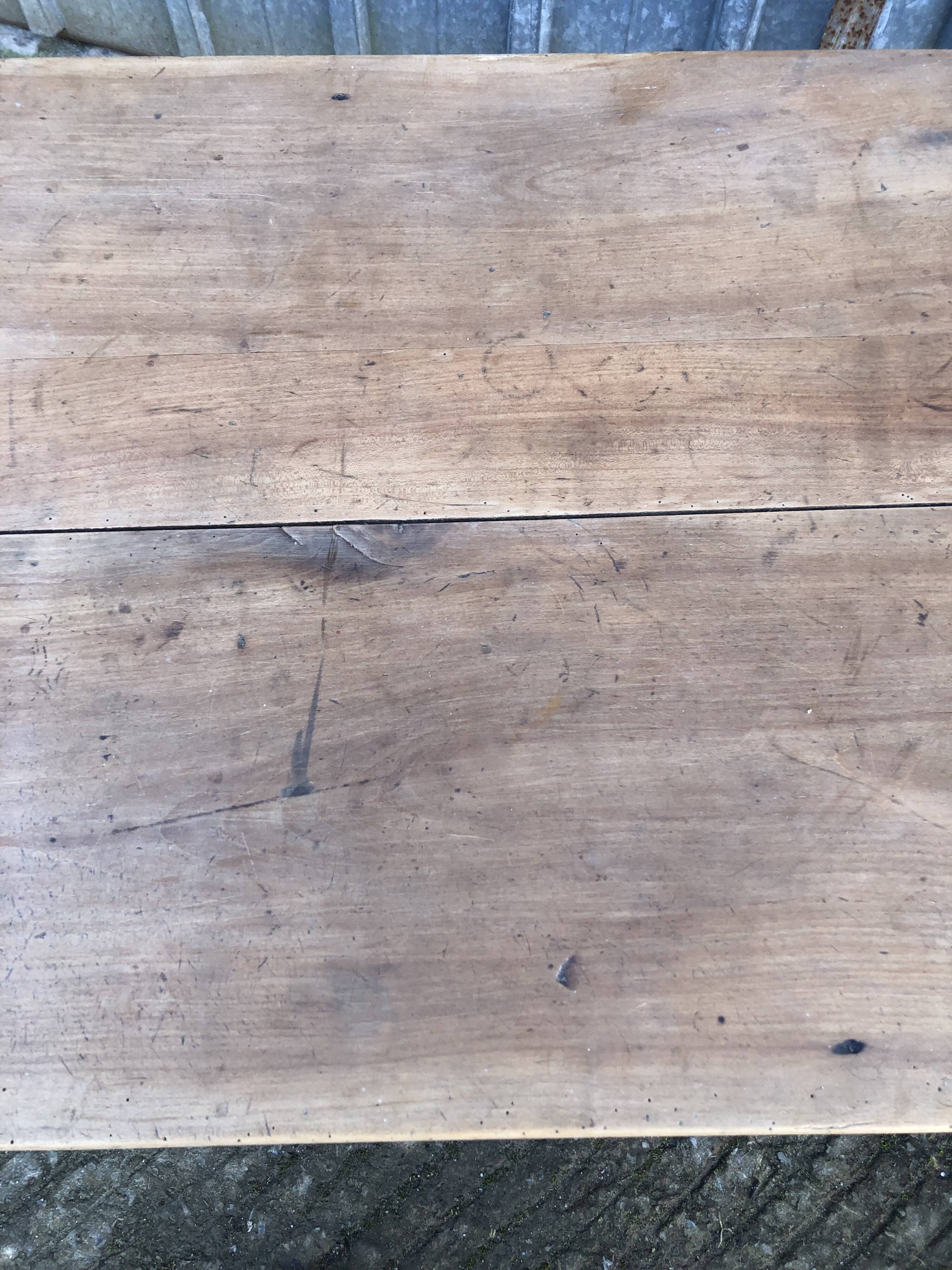 Antique solid cherry farmhouse table with 3 drawers and 1 pull out.