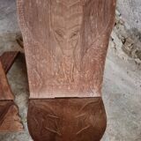 Pair of hand-carved wooden folding chairs – African origin, animal and face motifs, mid-20th century