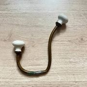 Vintage brass coat hook with ivory-style knob