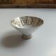 Solitaire tea cup, saucer, and dessert plate in white and gold.