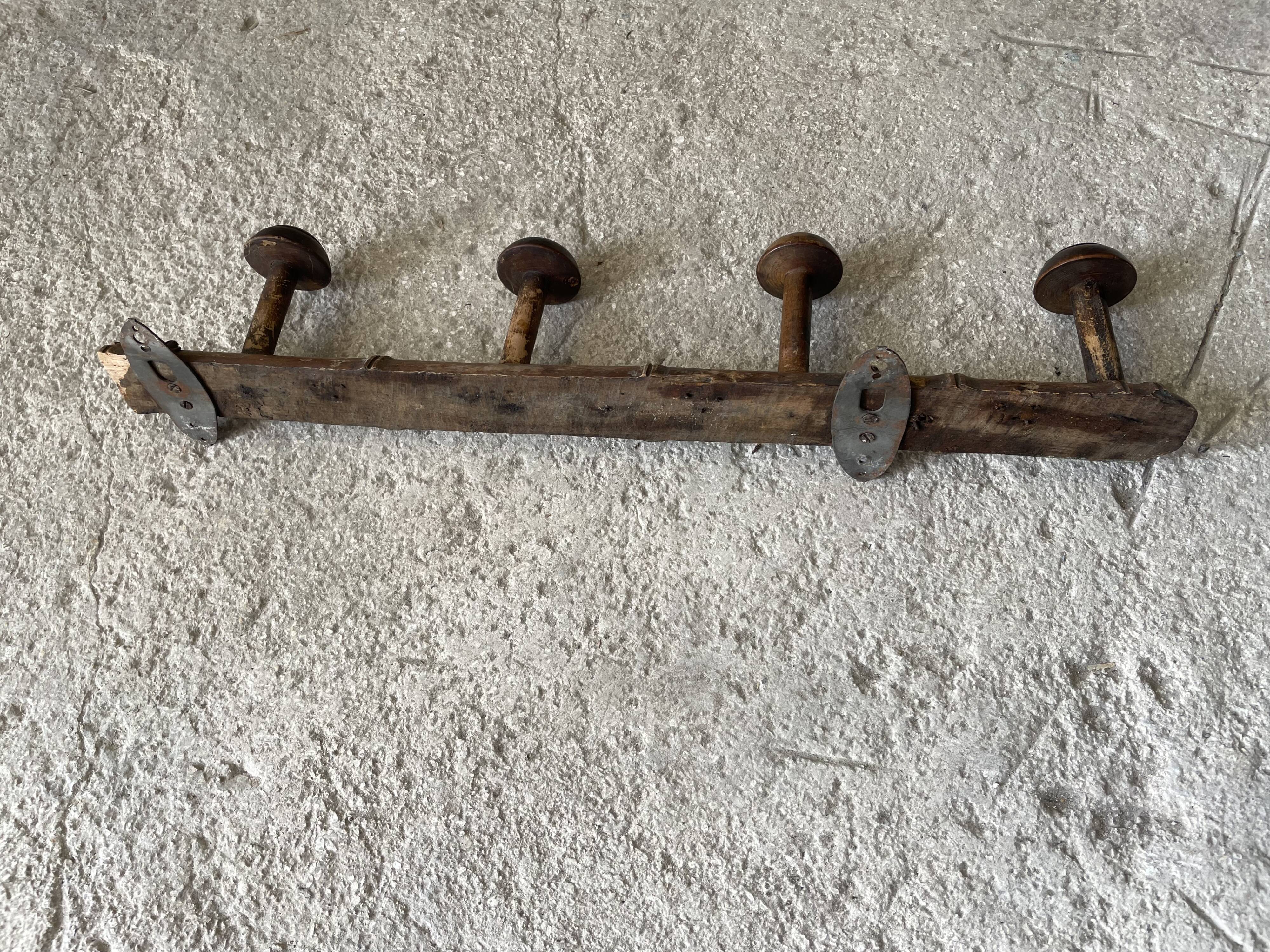 Old wooden wall coat rack