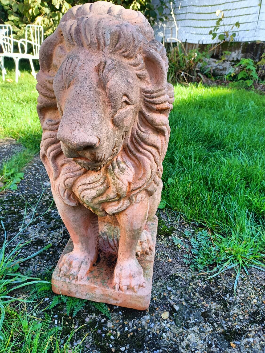 Pair of old terracotta garden lions