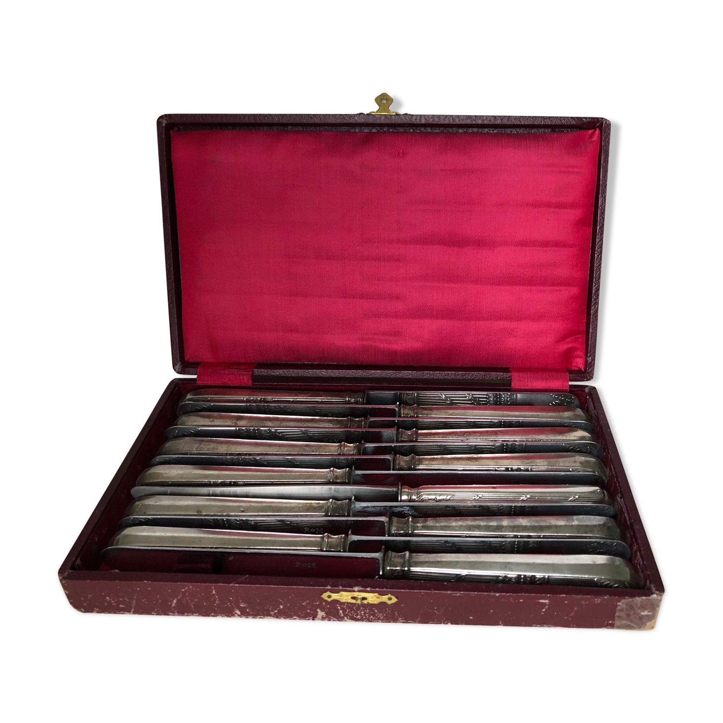 Set of 12 silver metal knives