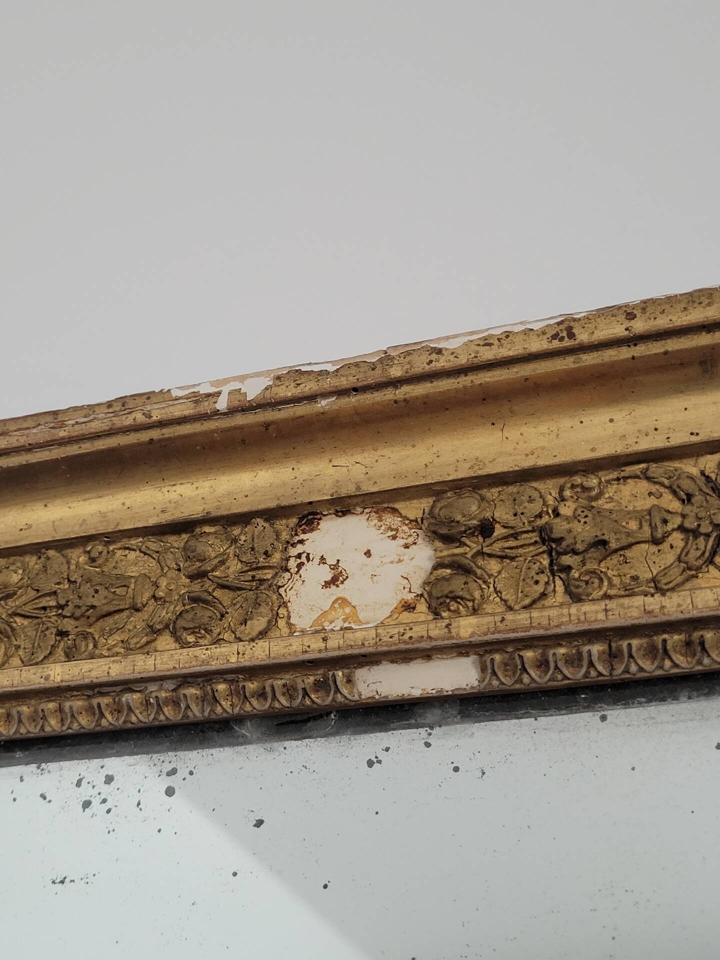 Golden stucco and wood Empire mirror