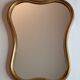 Vintage baroque style mirror, with curved frame in stucco and gilded wood 57 cm