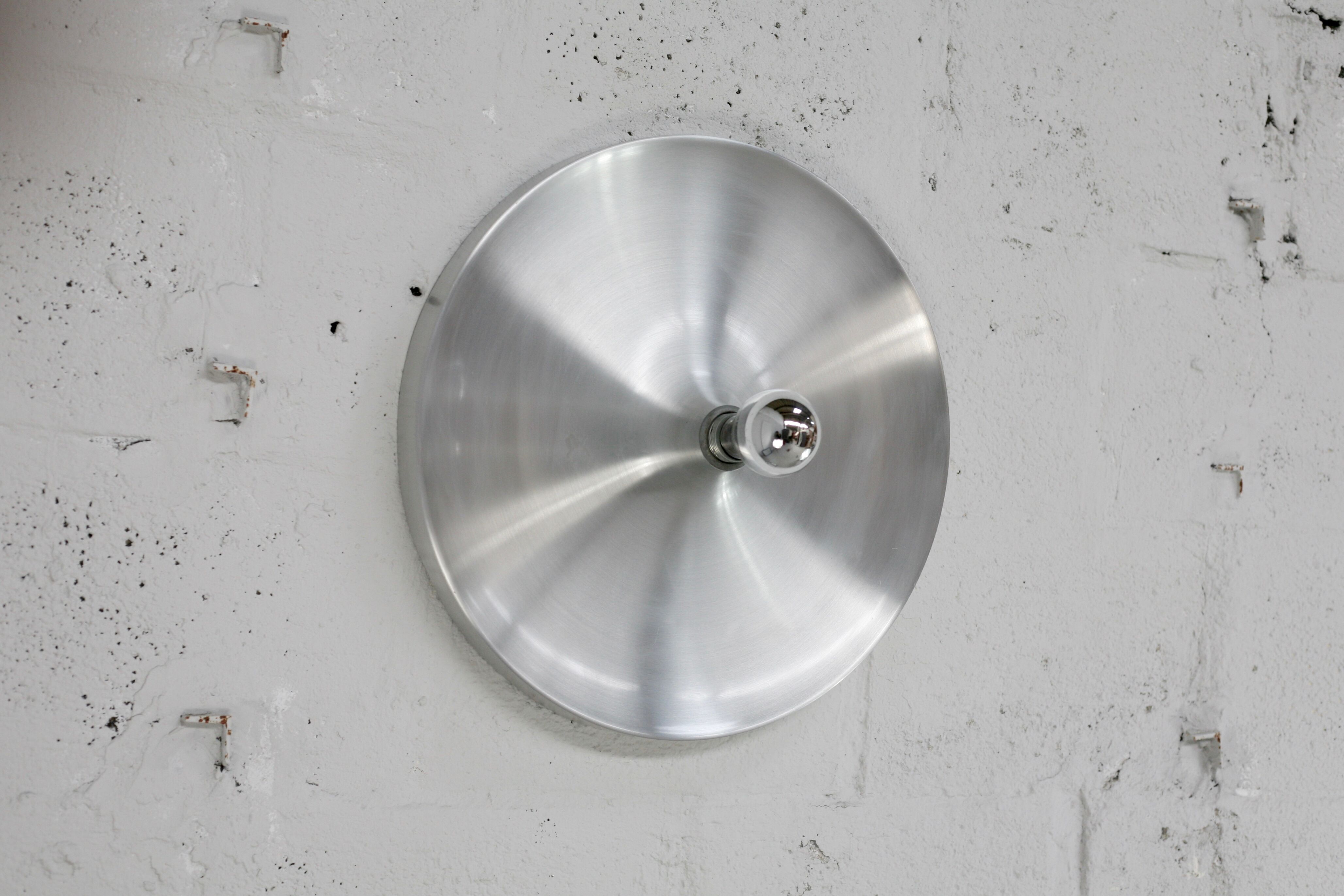 “Space age” wall lamp in aluminum. Circa 1970