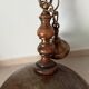 Rustic old wooden and brass suspension.