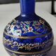 Cobalt blue ball vase/Hand painted floral motifs & raised gold edging