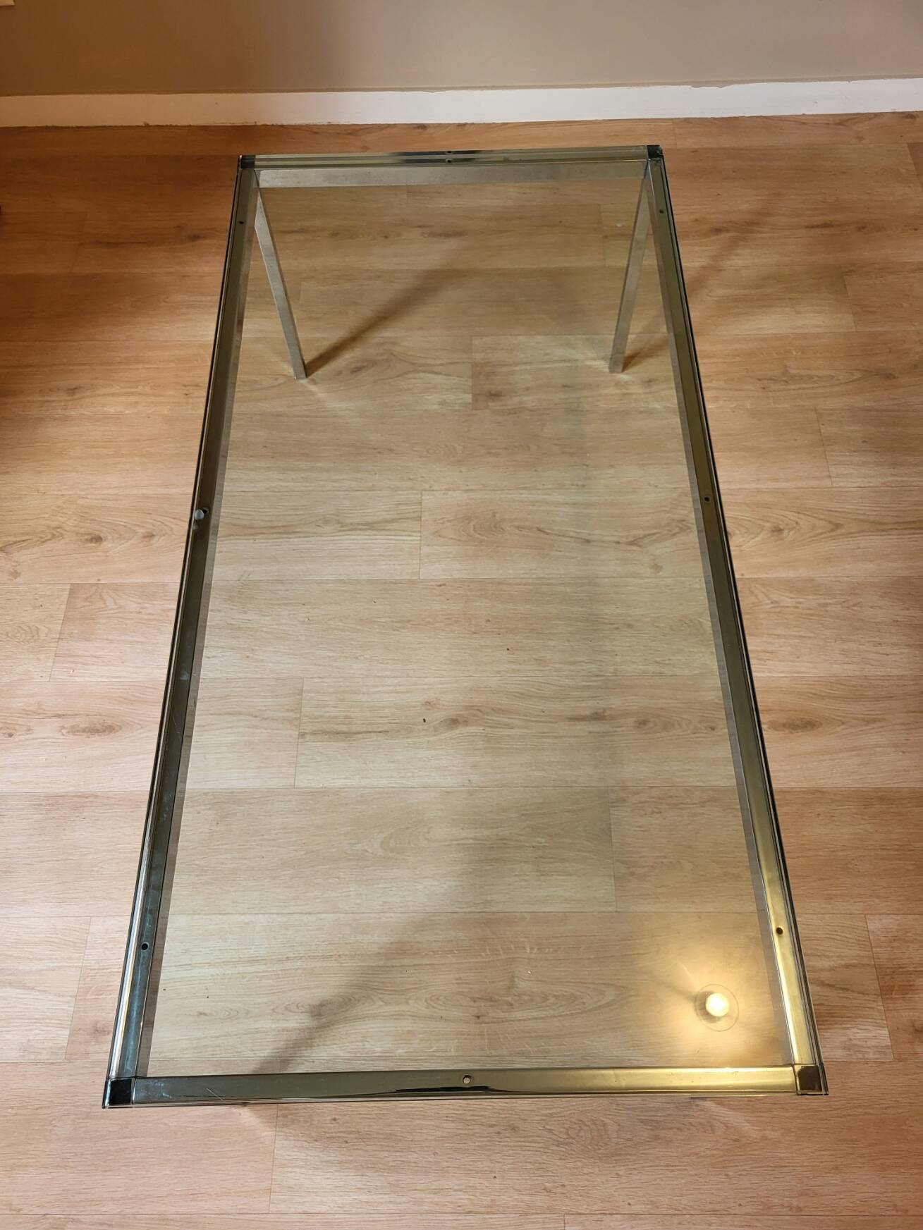 Knoll coffee table with smoked glass top and chrome metal.