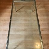 Knoll coffee table with smoked glass top and chrome metal.