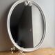Vintage oval mirror in white enamelled cast iron