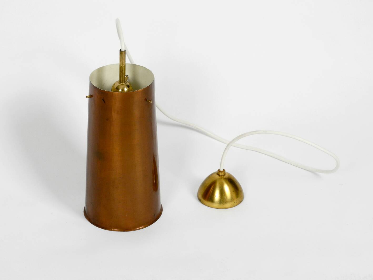 Beautiful Mid Century Modern pendant lamp made of copper shaped like a cone