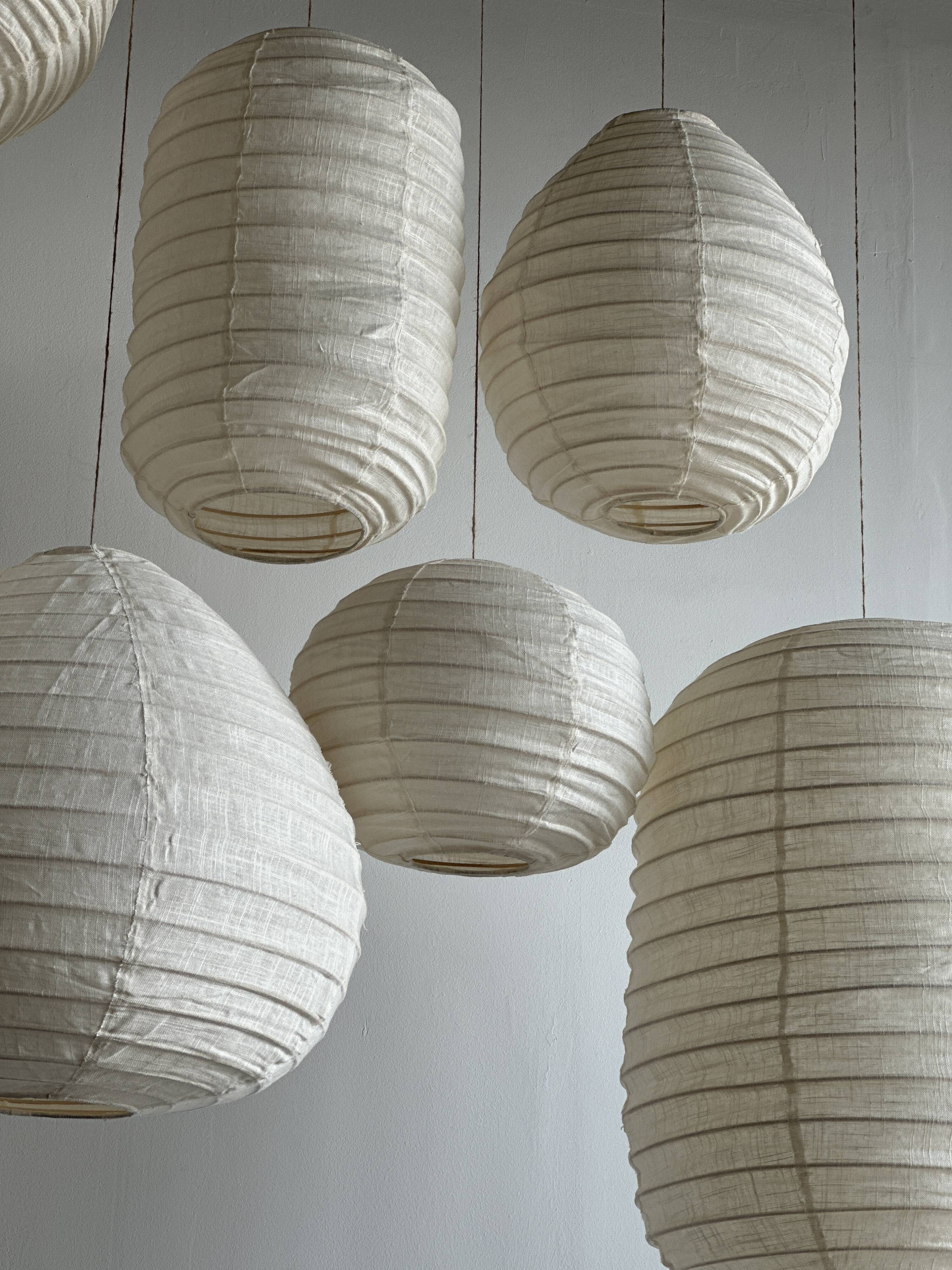 Suspension in rattan and natural japanese linen in the shape of a drop