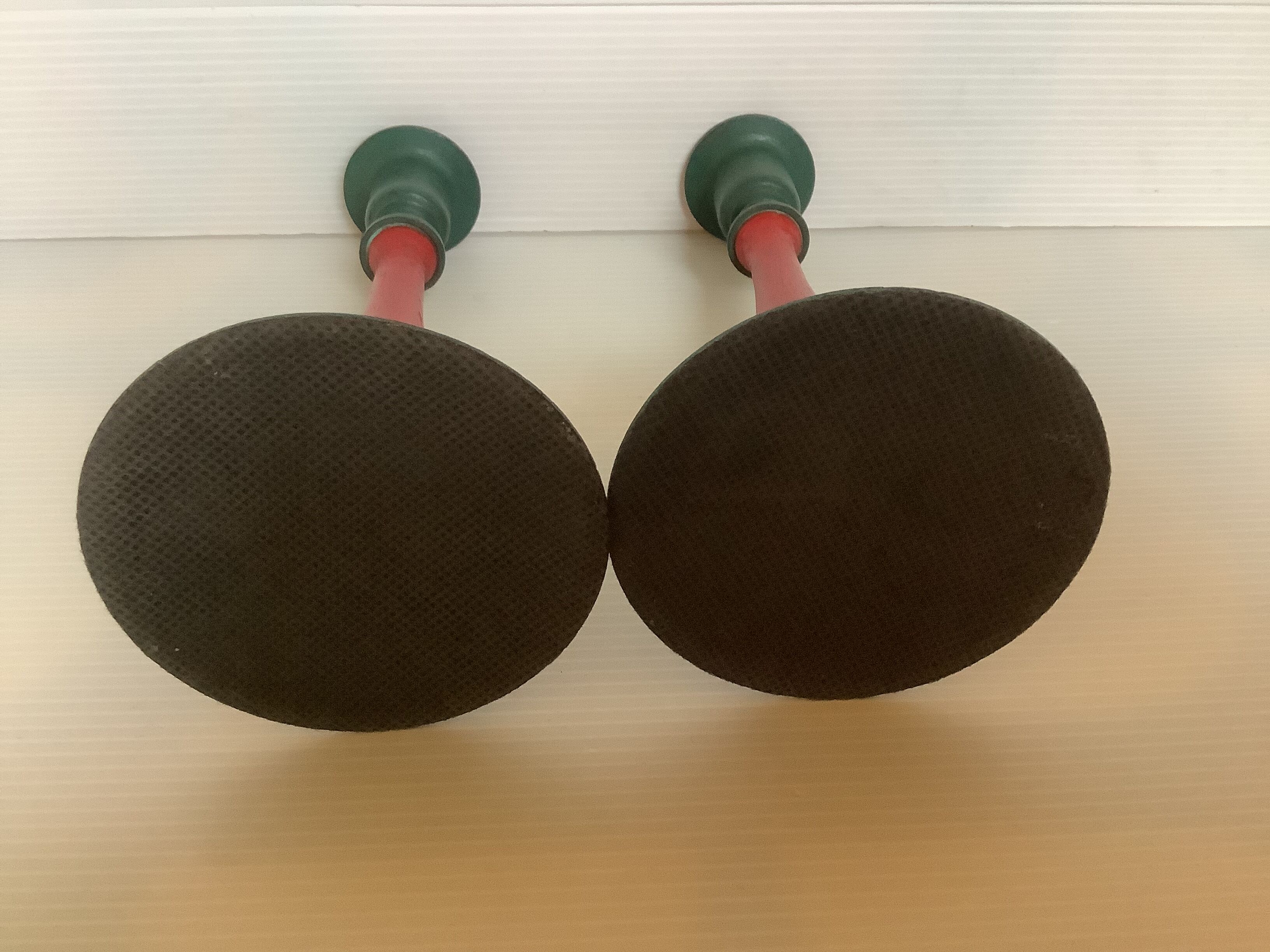 Pair of cast iron and wood candle holders