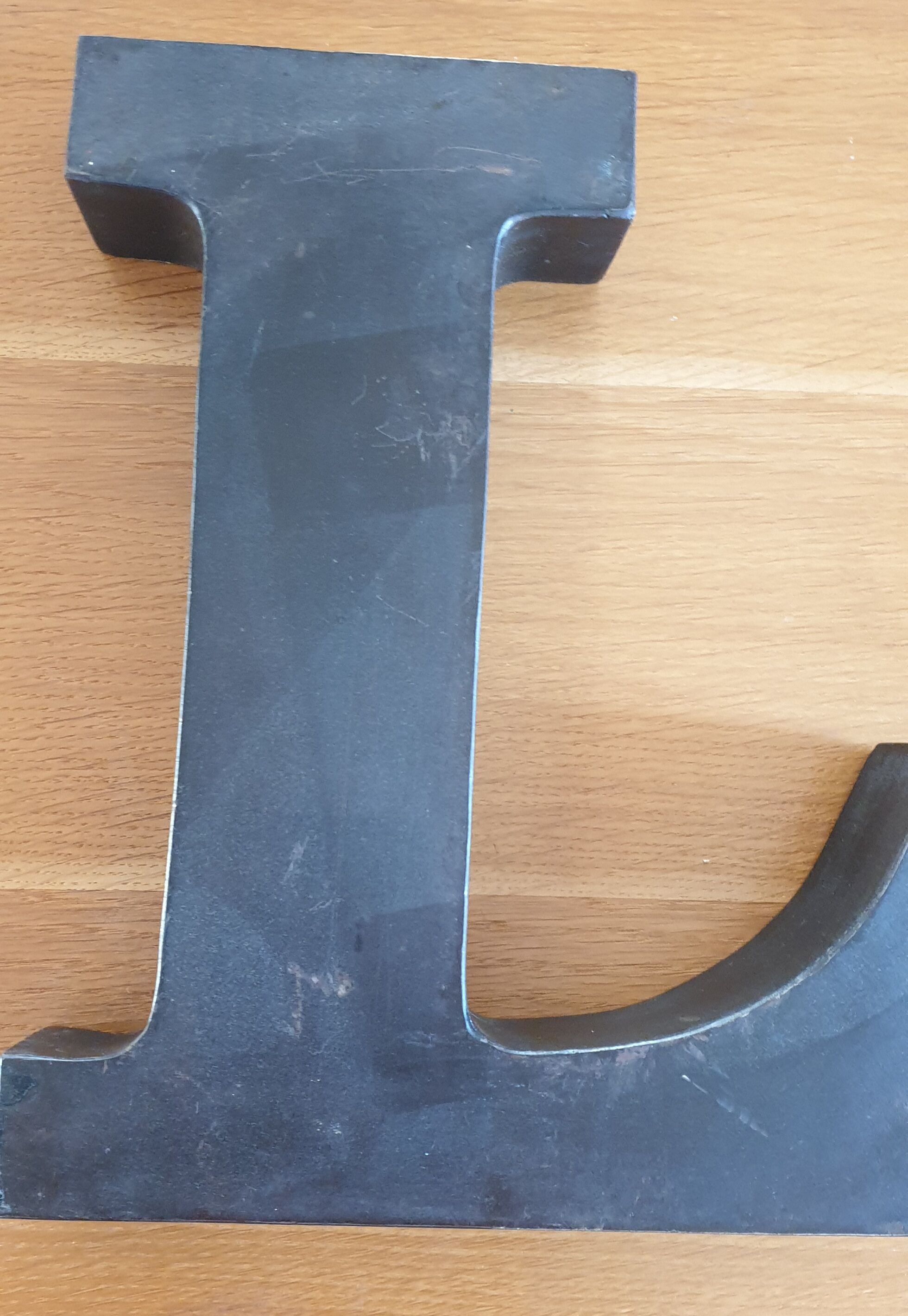 Letter l black metal