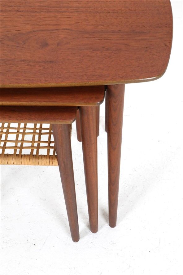 Rare set of three teak nesting tables with cane magazine rack / side tables / mid-century Danish modern design / 1950s / 1960s