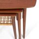 Rare set of three teak nesting tables with cane magazine rack / side tables / mid-century Danish modern design / 1950s / 1960s