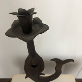 Old and patinated metal candlestick