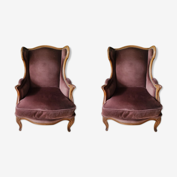 Paire de fauteuils à oreilles de style Louis XVI