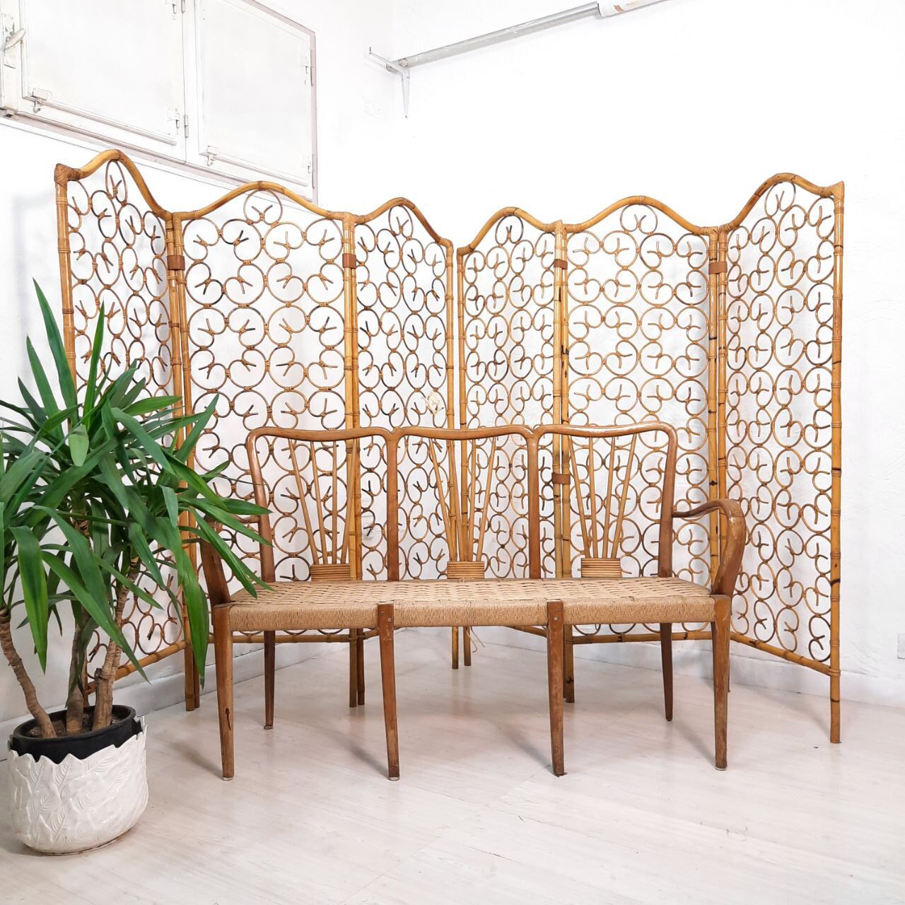 Vintage screen made of bamboo, wicker and leather