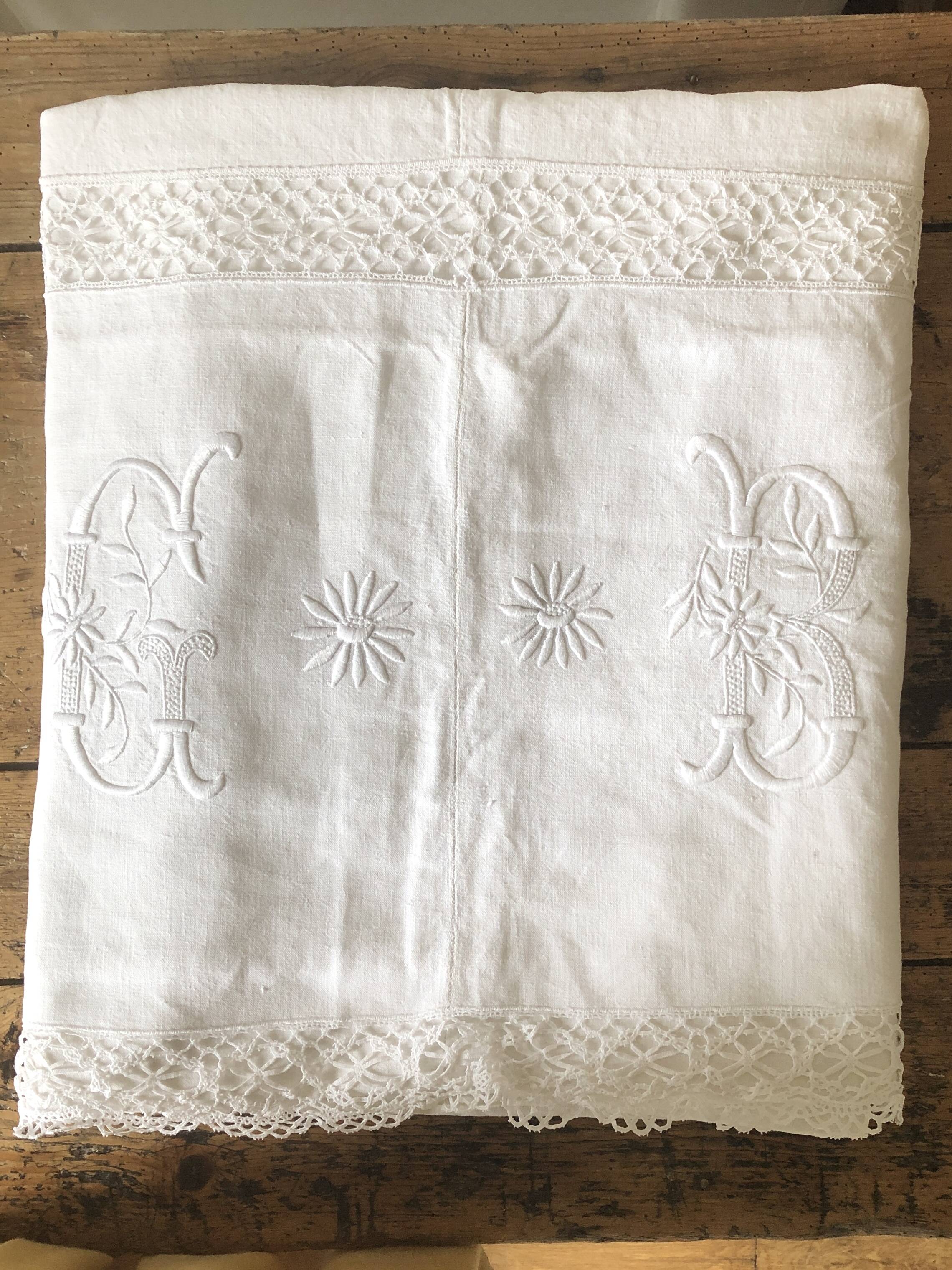 Old embroidered cloth, monograms and lace