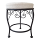 Black iron stool/pouf with its boucle fabric cushion.