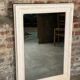 Louis XV-style mirror in wood and white stucctuc and patinated beige