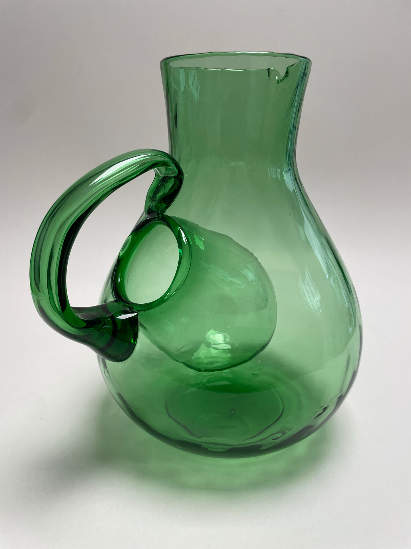 Large green glass cooling jug