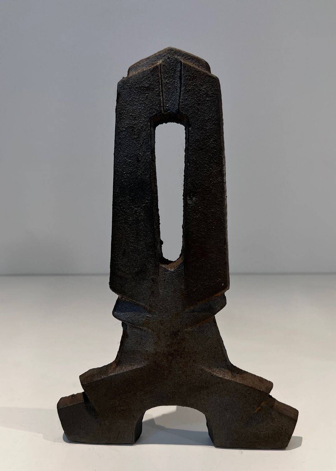Pair of Modernist Andirons in Cast Iron with Openwork Uprights and Tripod Bases