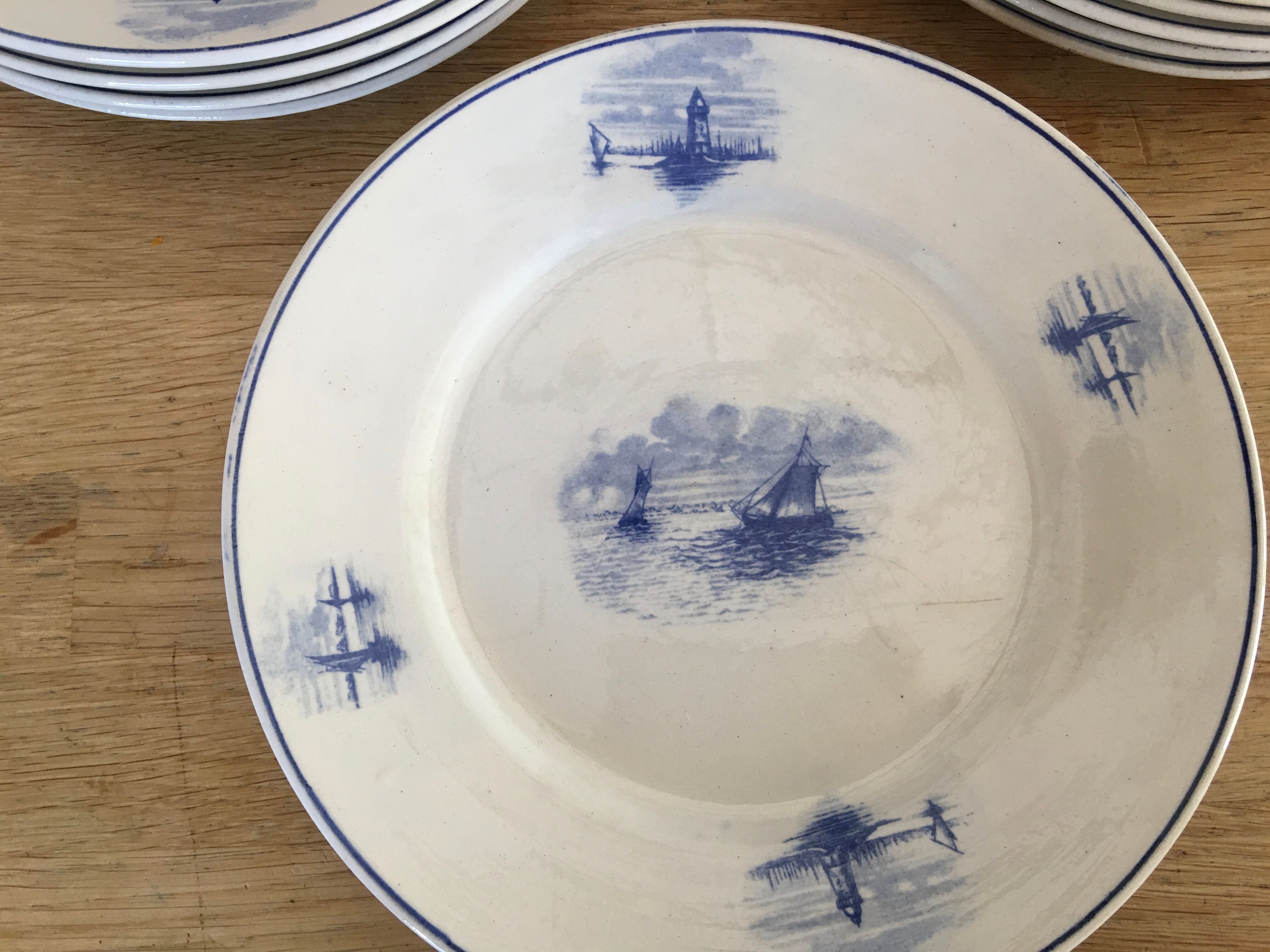 Series of 11 flat plates, Dutch earthenware, early XX