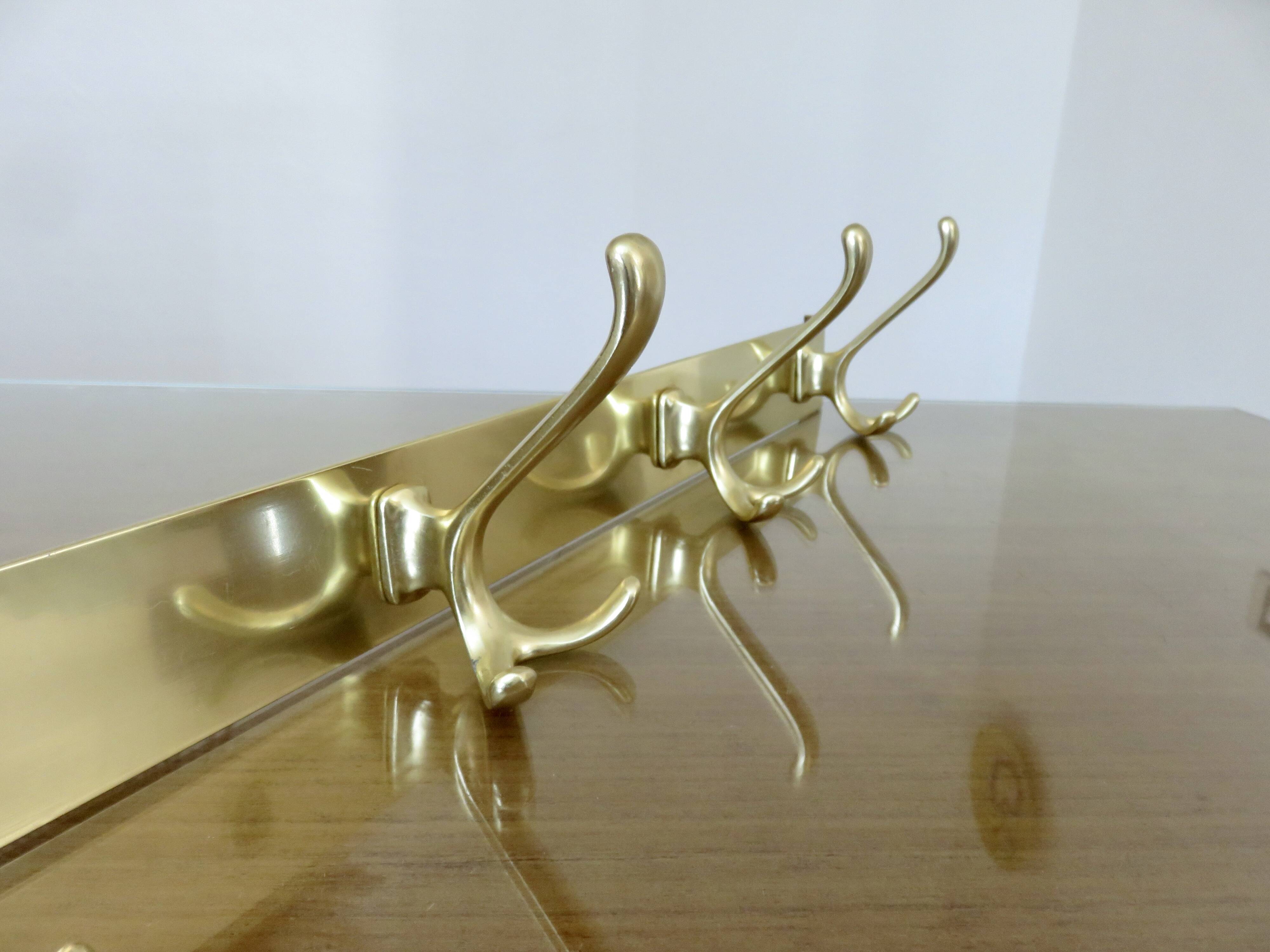 Large wall-mounted coat rack in gold aluminum, 60s-70s