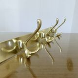 Large wall-mounted coat rack in gold aluminum, 60s-70s