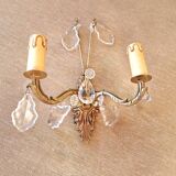 Gold wall light with tassel