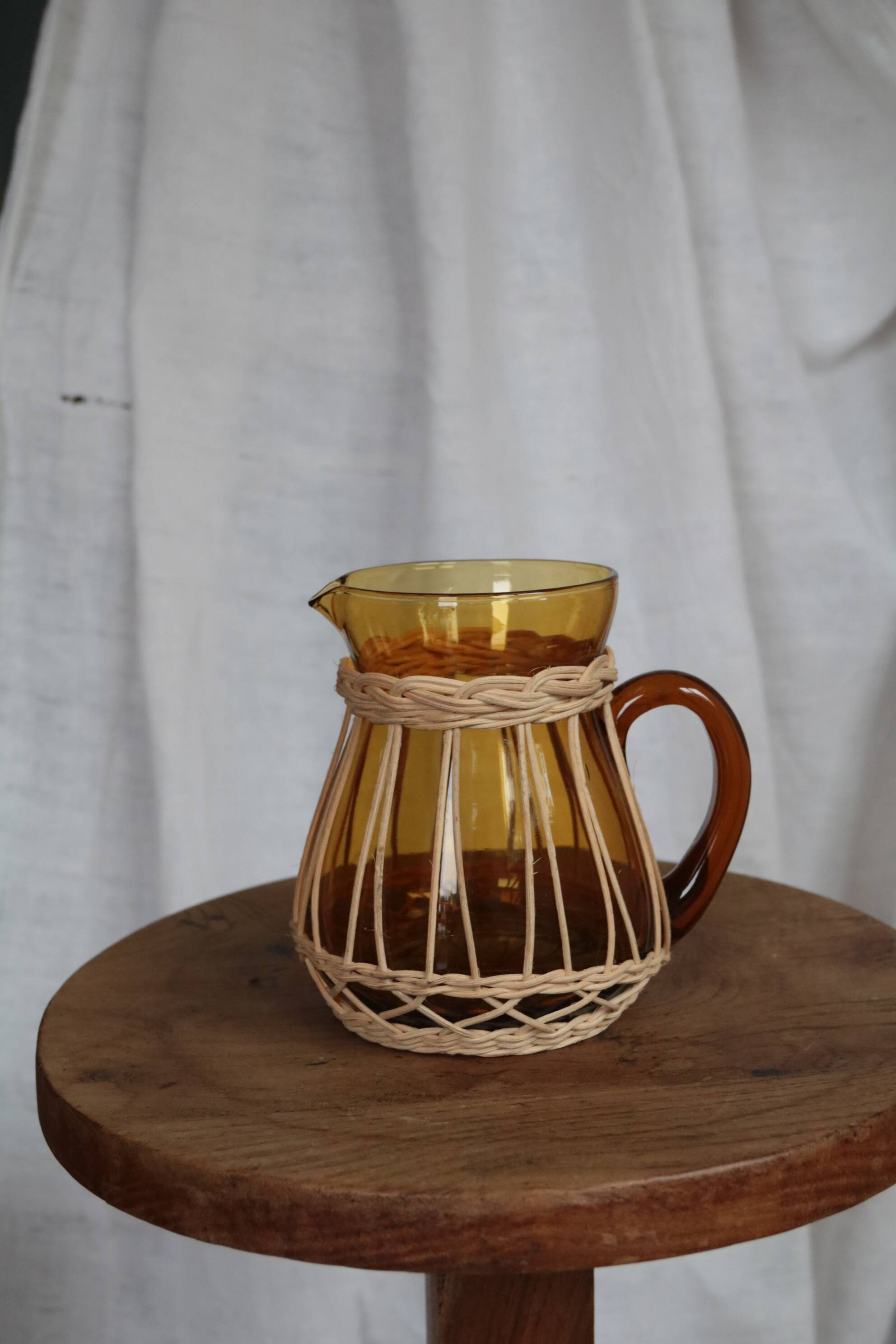 Amber glass and wicker carafe