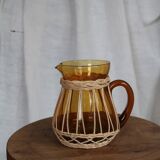 Amber glass and wicker carafe